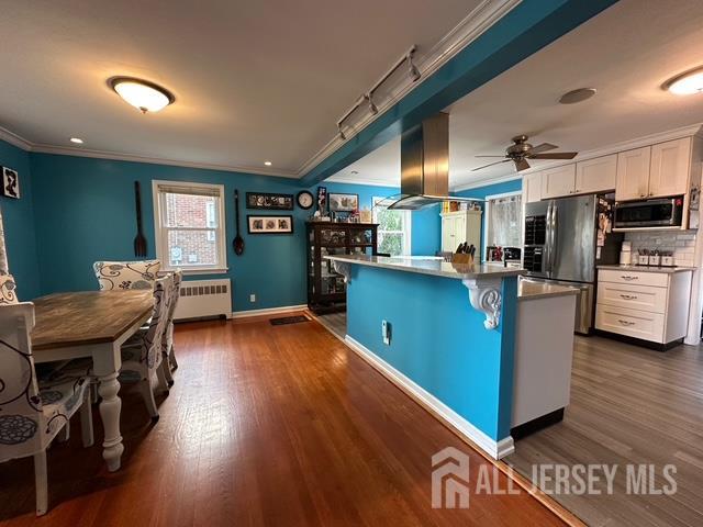 78 Schoder Avenue Woodbridge, NJ 07095 - Photo 9 of 26 a kitchen with cabinets and wooden floor