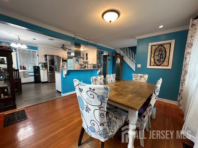 78 Schoder Avenue Woodbridge, NJ 07095 - Photo 10 of 26 a dining room with furniture and wooden floor