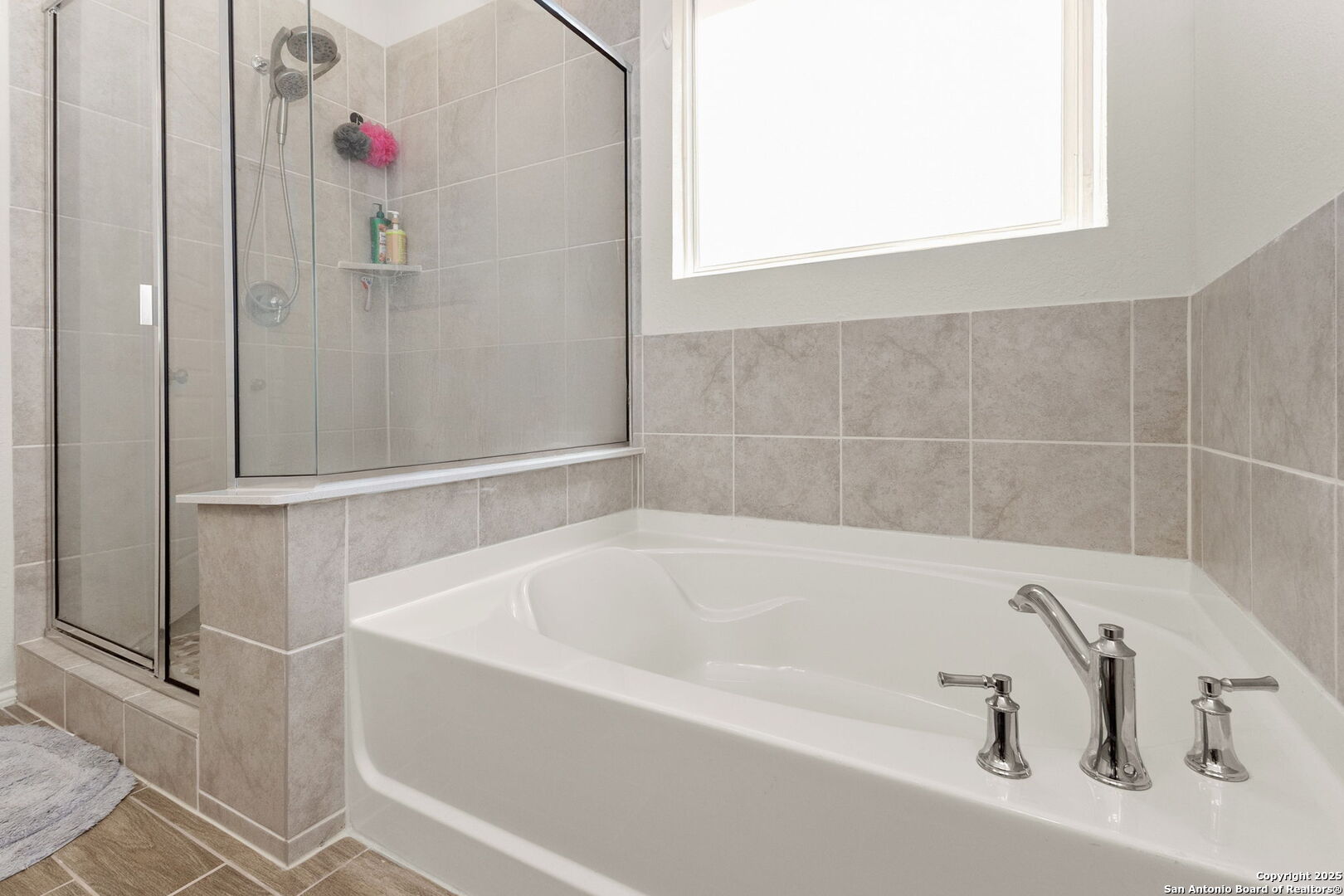 4012 Wild Bloom Road Seguin, TX 78155 - Photo 14 of 26 a white bath tub sitting next to a white cabinet