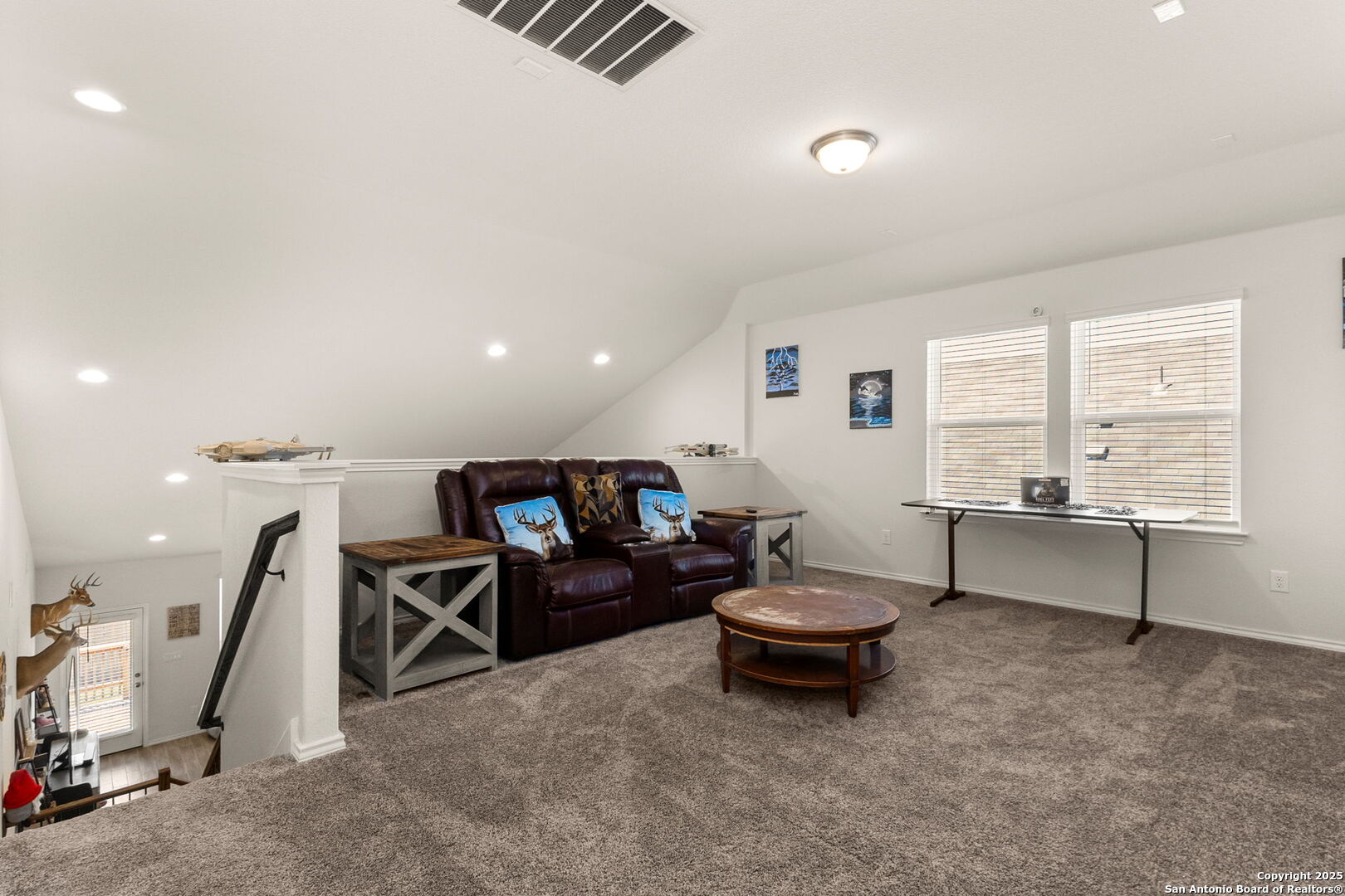 4012 Wild Bloom Road Seguin, TX 78155 - Photo 18 of 26 a living room with a couch and a large window