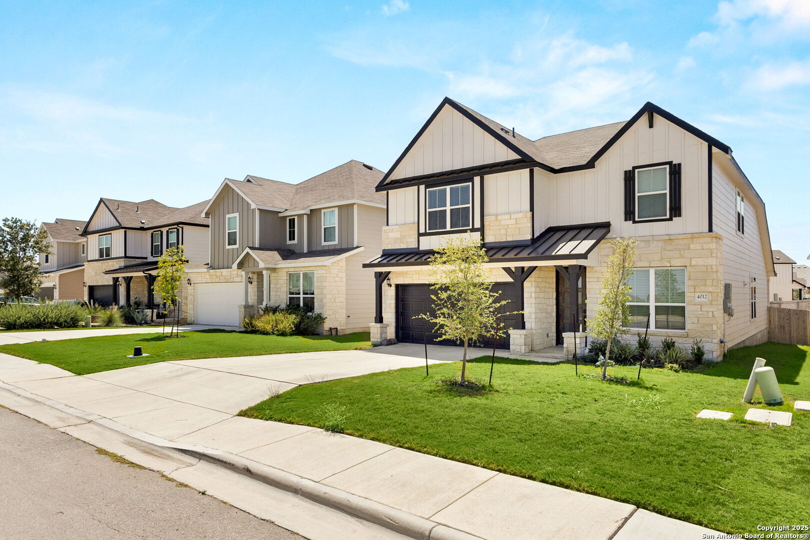 4012 Wild Bloom Road Seguin, TX 78155 - Photo 2 of 26 a front view of a house with a yard and garage