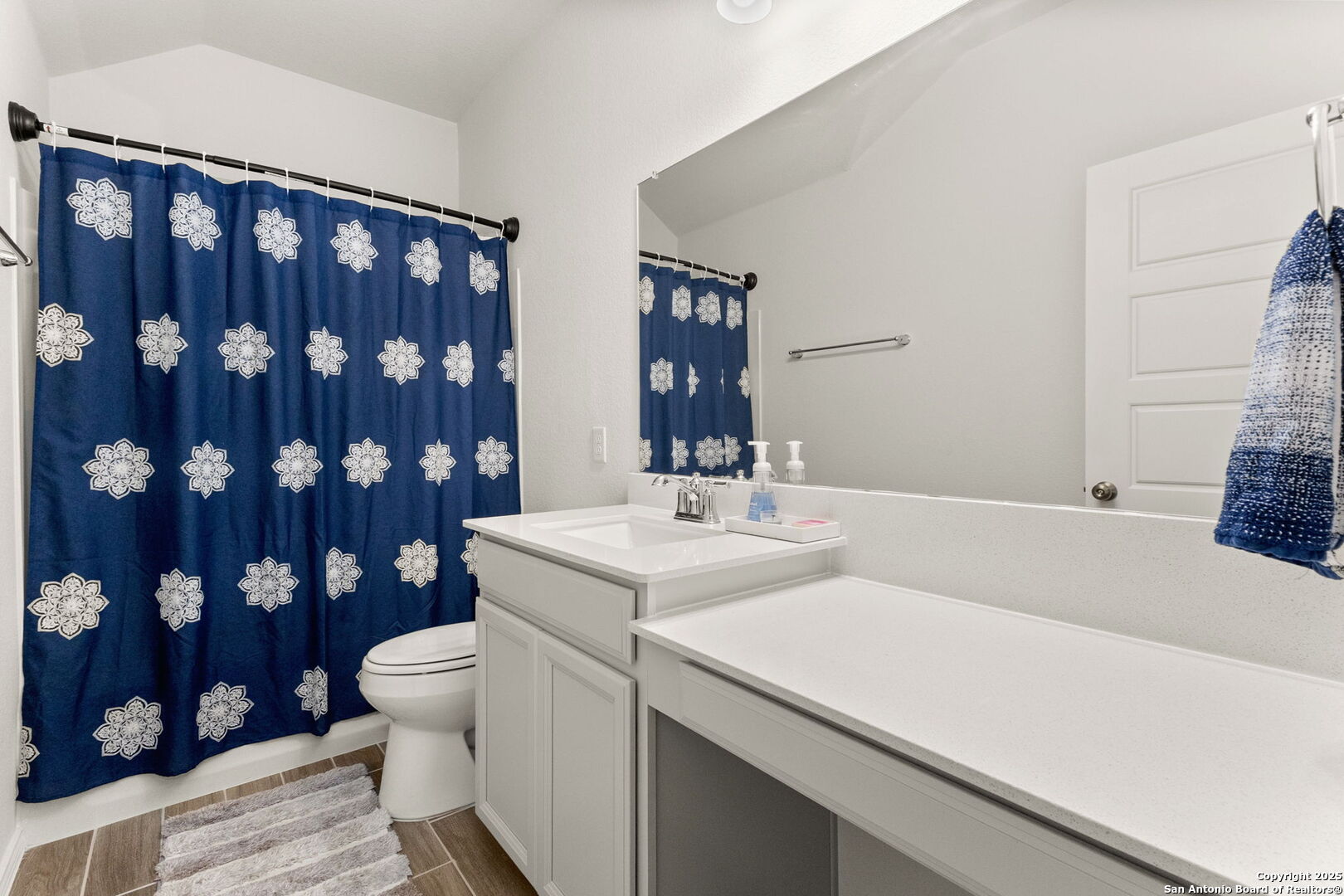 4012 Wild Bloom Road Seguin, TX 78155 - Photo 21 of 26 a bathroom with a sink a toilet and shower