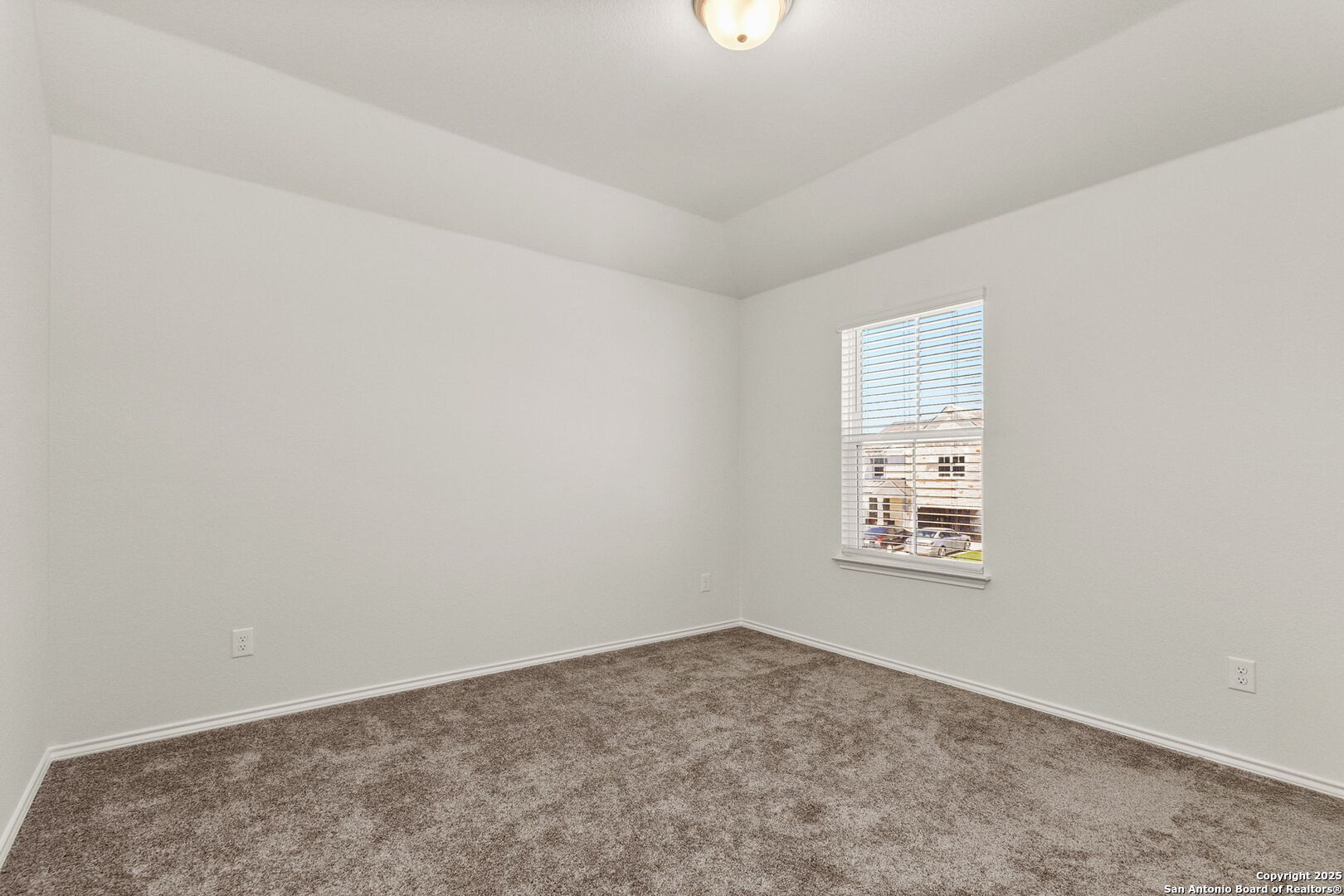4012 Wild Bloom Road Seguin, TX 78155 - Photo 22 of 26 an empty room with windows