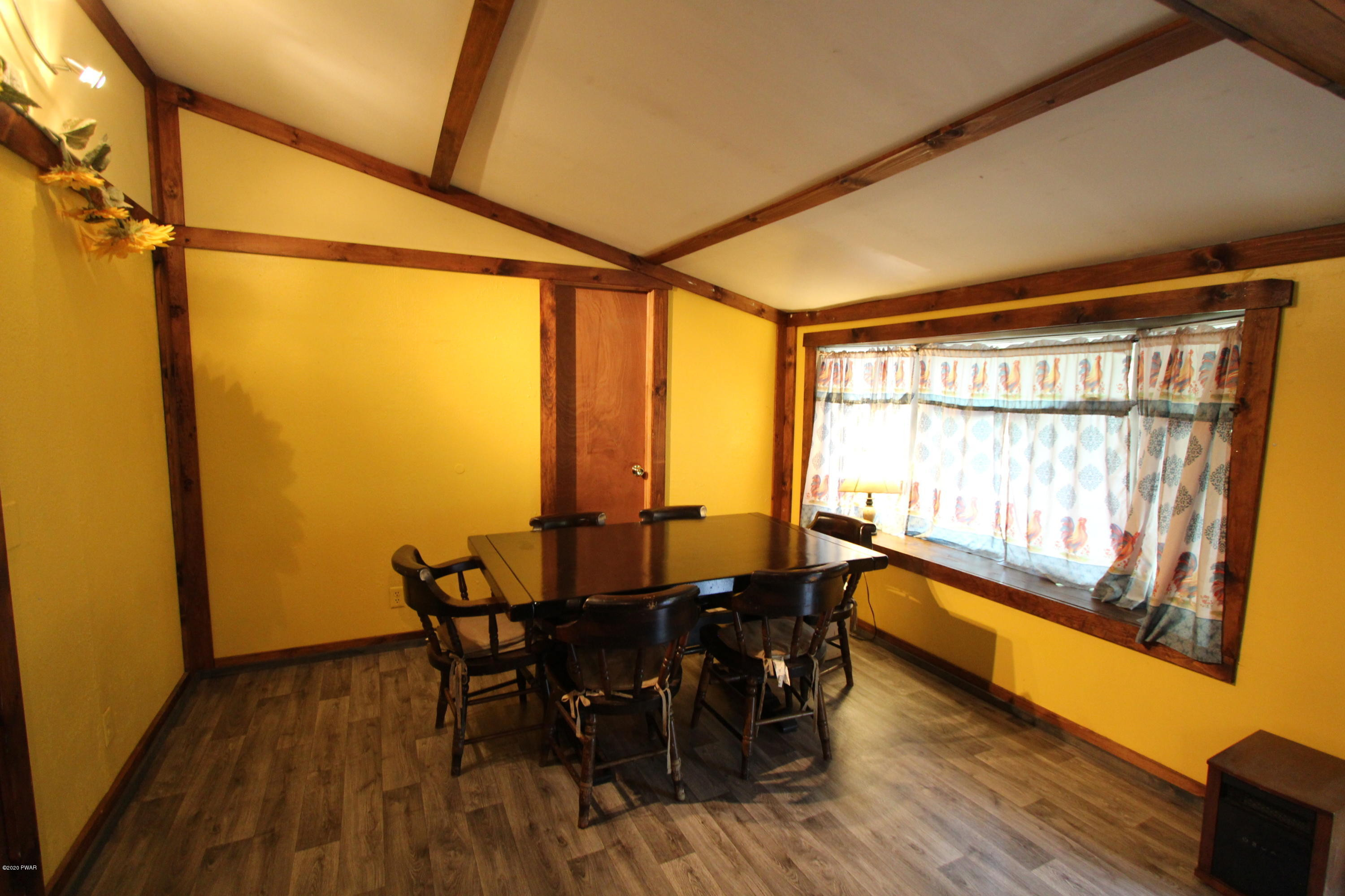 89 Sterling Gardens Road Moscow, PA 18444 - Photo 11 of 22 a view of a dining room with furniture and wooden floor