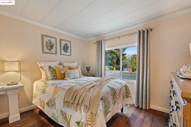 a bathroom with a sink a toilet a mirror and shower