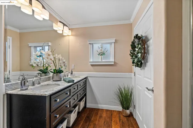 an empty room with wooden floor and window