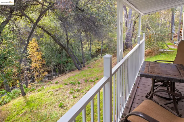 a view of a chair and table in balcony