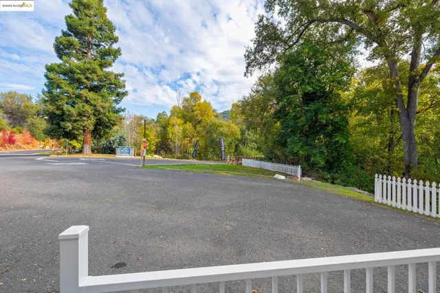 a view of a deck with wooden floor and seating space