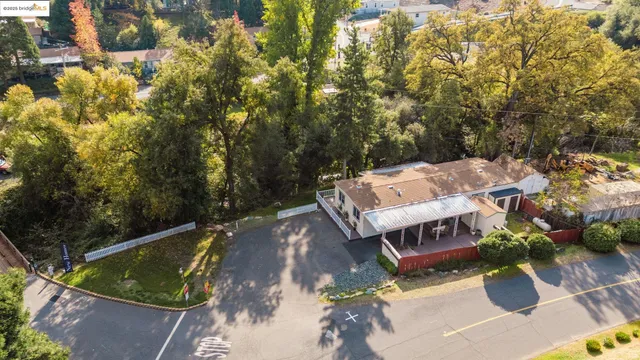 a view of a backyard with sitting area