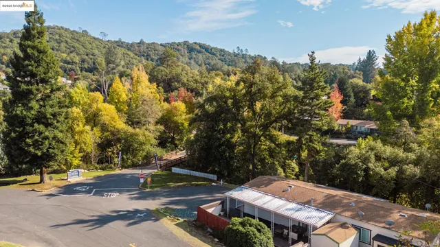 an aerial view of a house with a yard
