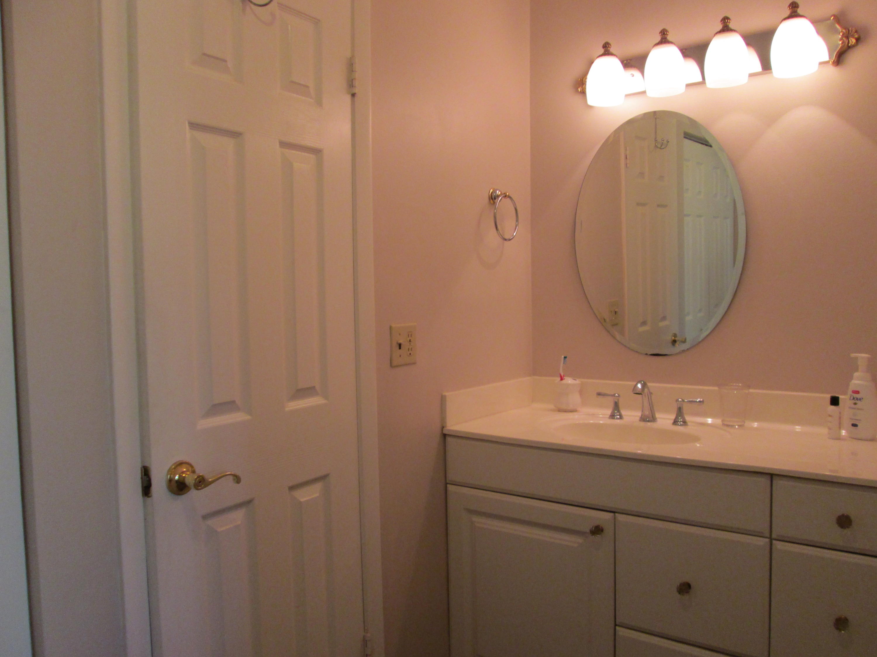 388 Golfview Road, Unit C North Palm Beach, FL 33408 - Photo 13 of 16 a bathroom with a sink and a mirror