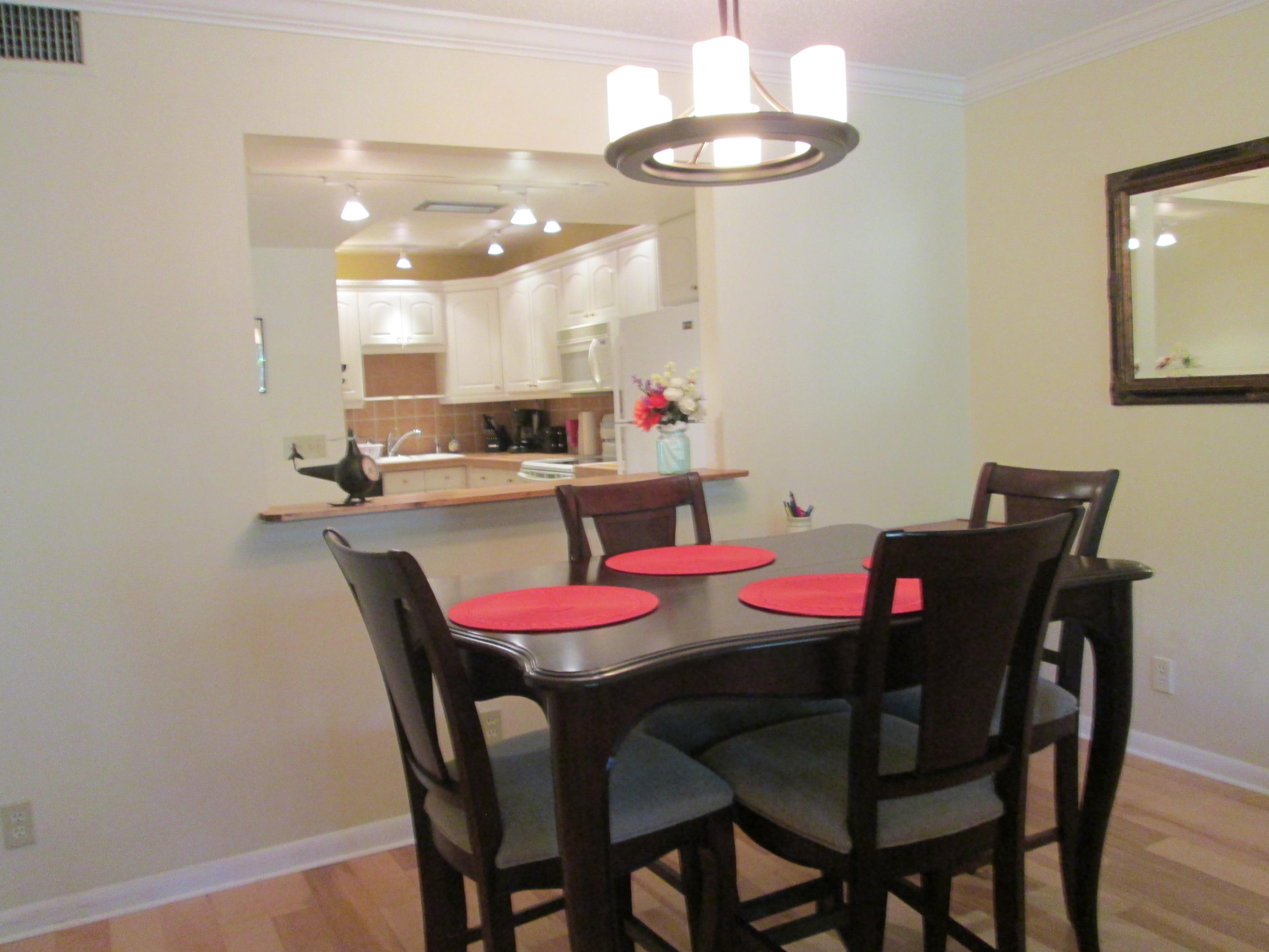 388 Golfview Road, Unit C North Palm Beach, FL 33408 - Photo 4 of 16 a view of a dining room with furniture