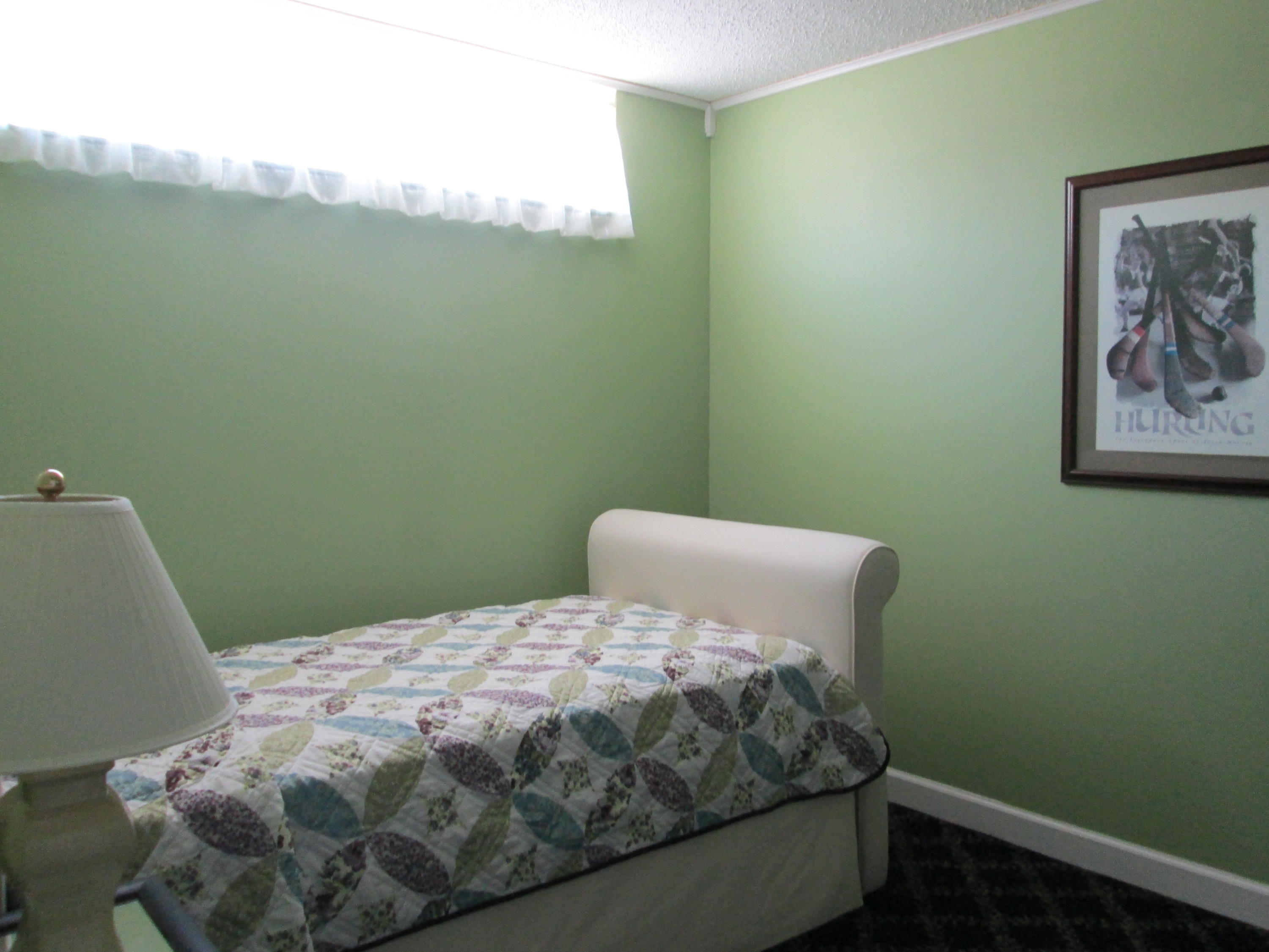 388 Golfview Road, Unit C North Palm Beach, FL 33408 - Photo 10 of 16 a bedroom with a bed and a window