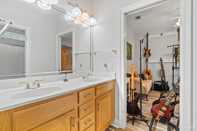 a bathroom with a sink double vanity and a mirror