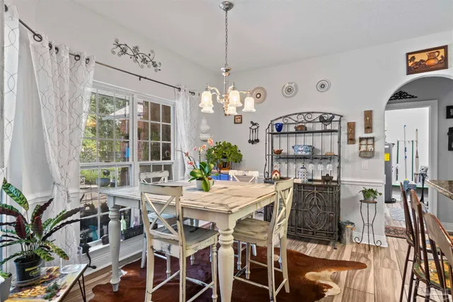 a view of a dining room with furniture window and outside view