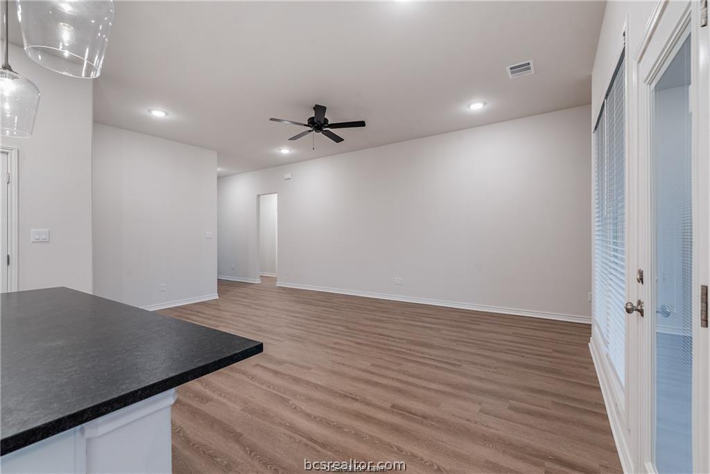 3161 Tarleton Court Bryan, TX 77808 - Photo 7 of 23 a view of a hallway with wooden floor
