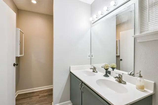 a bathroom with a sink and a mirror