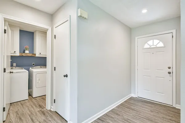 a view of hallway with wooden floor