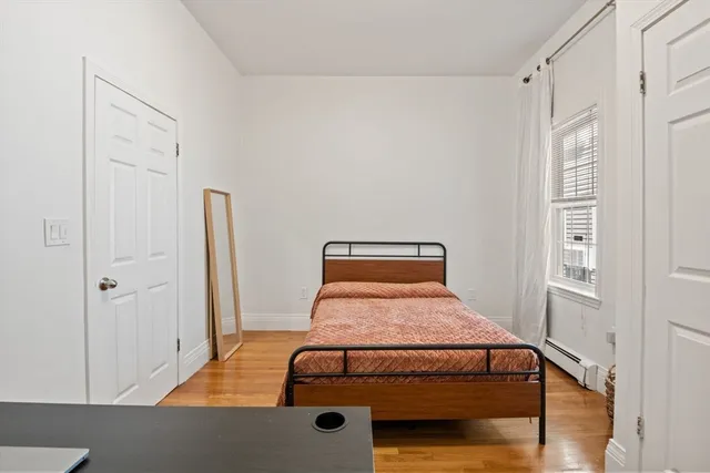 a room with a bed and a window