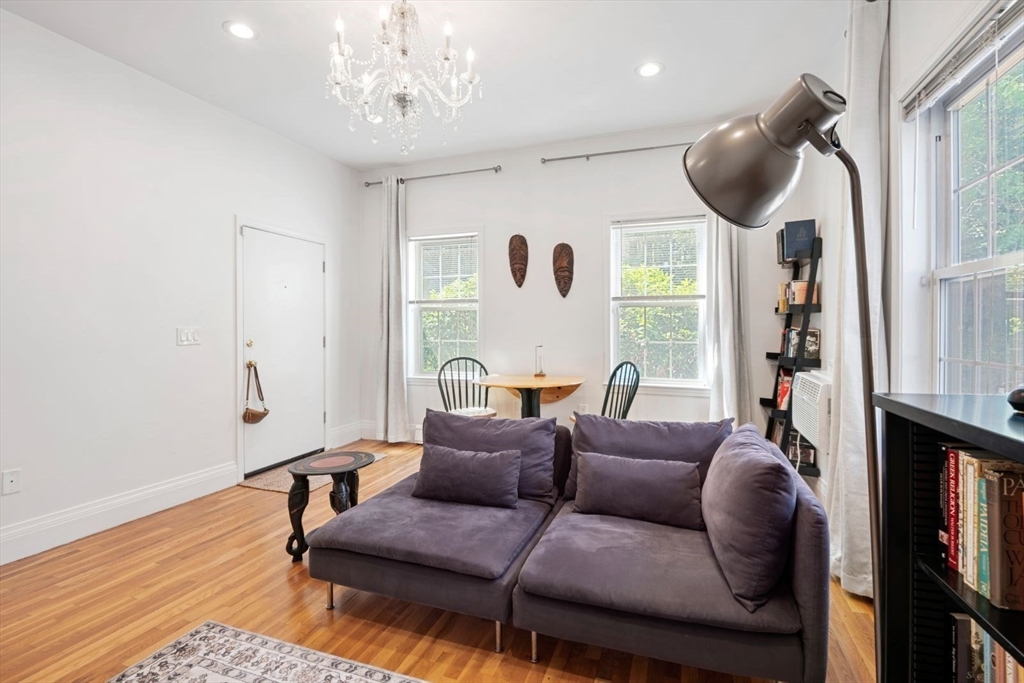 249 Roxbury Street, Unit 1 Boston, MA 02119 - Photo 3 of 19 a living room with furniture and a large window