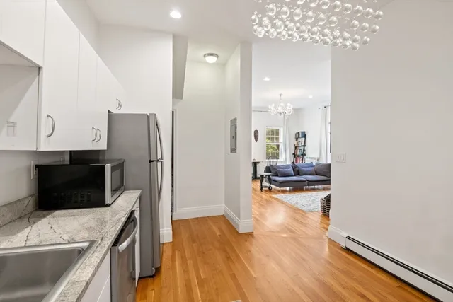 a kitchen with a refrigerator and a sink