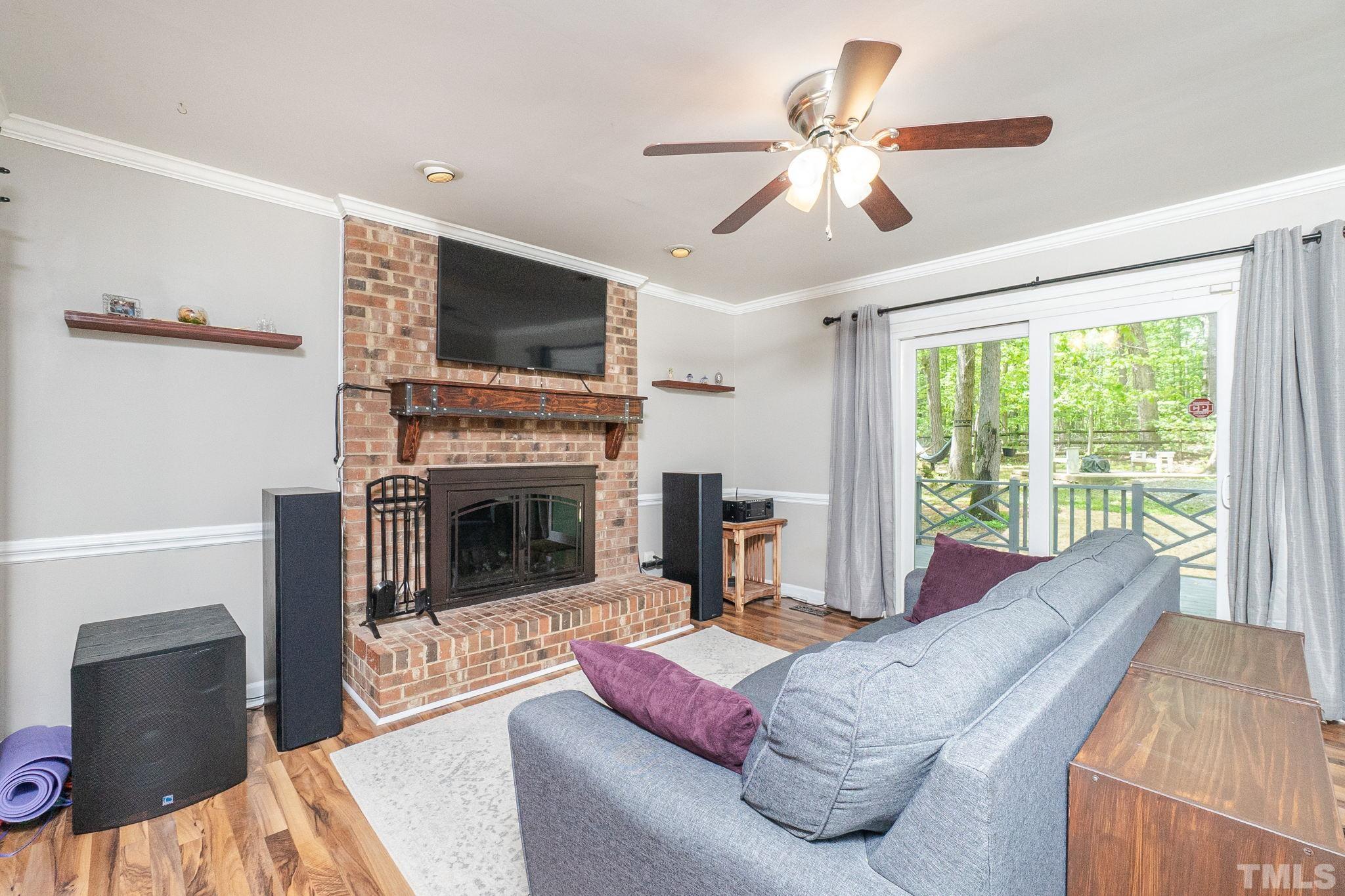 6313 Craig Road Durham, NC 27712 - Photo 11 of 38 a living room with furniture and a fireplace