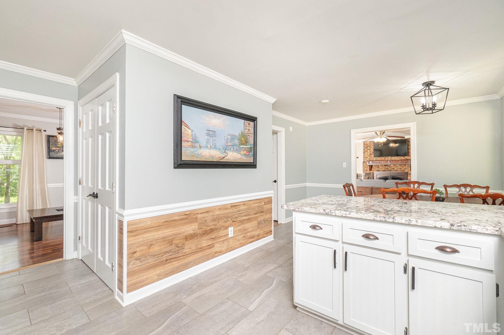 6313 Craig Road Durham, NC 27712 - Photo 19 of 38 a view of a bathroom with a sink and a mirror