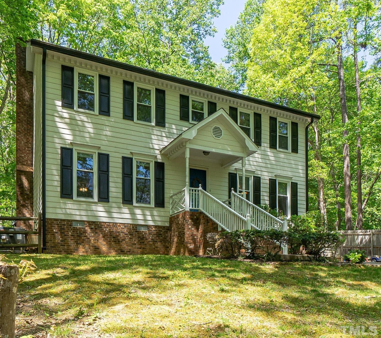 6313 Craig Road Durham, NC 27712 - Photo 2 of 38 a front view of a house with a yard