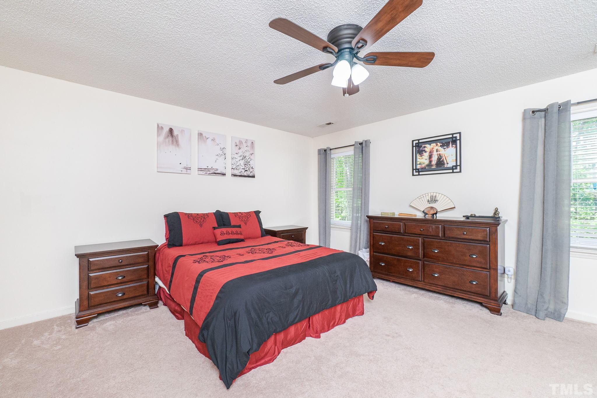6313 Craig Road Durham, NC 27712 - Photo 24 of 38 a bedroom with a bed and a window