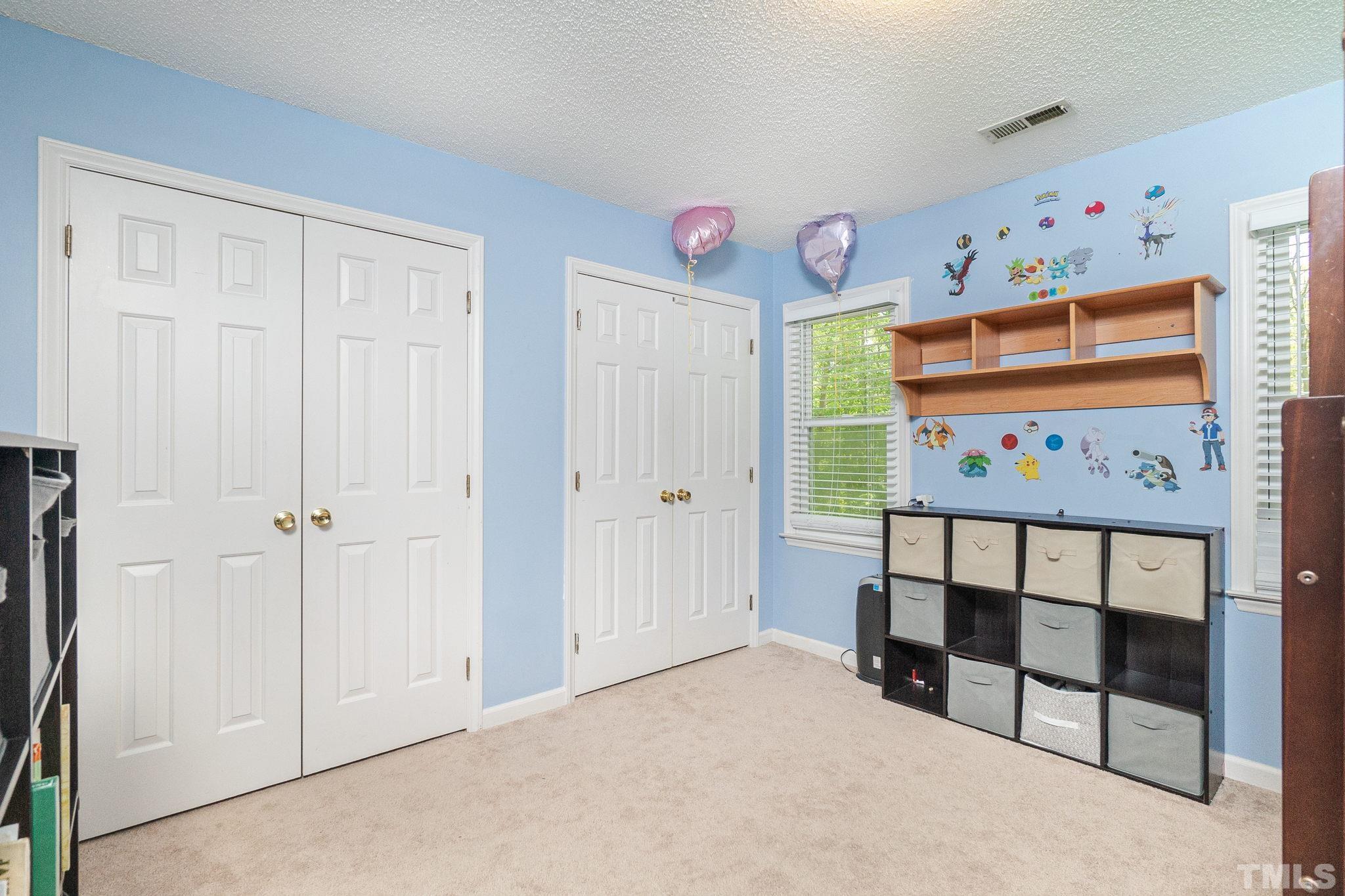 6313 Craig Road Durham, NC 27712 - Photo 28 of 38 a view of a hallway with workspace