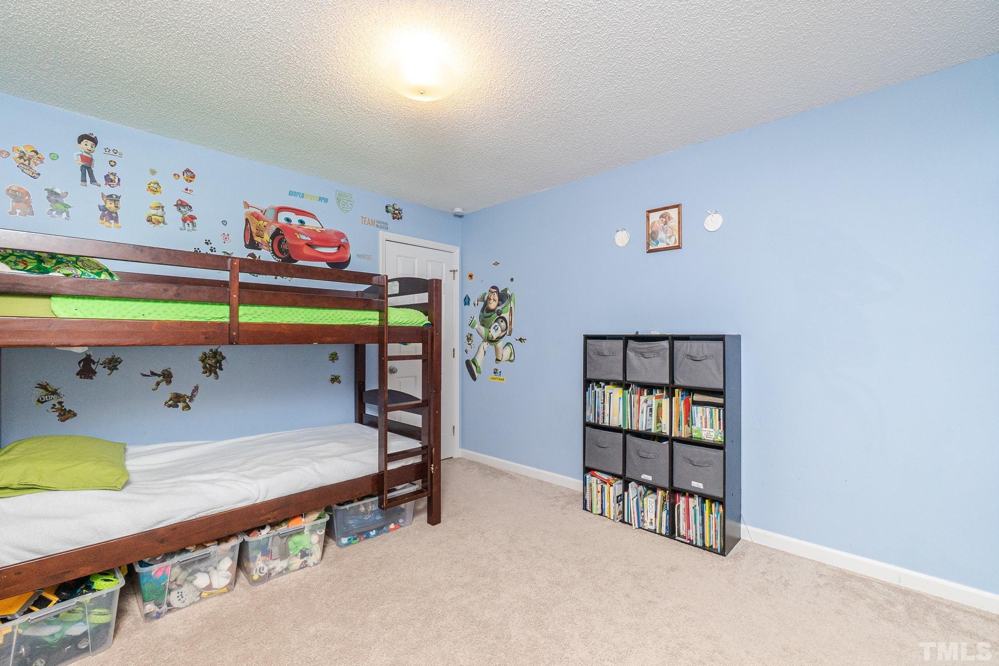 6313 Craig Road Durham, NC 27712 - Photo 29 of 38 a room with toys and painting on the wall