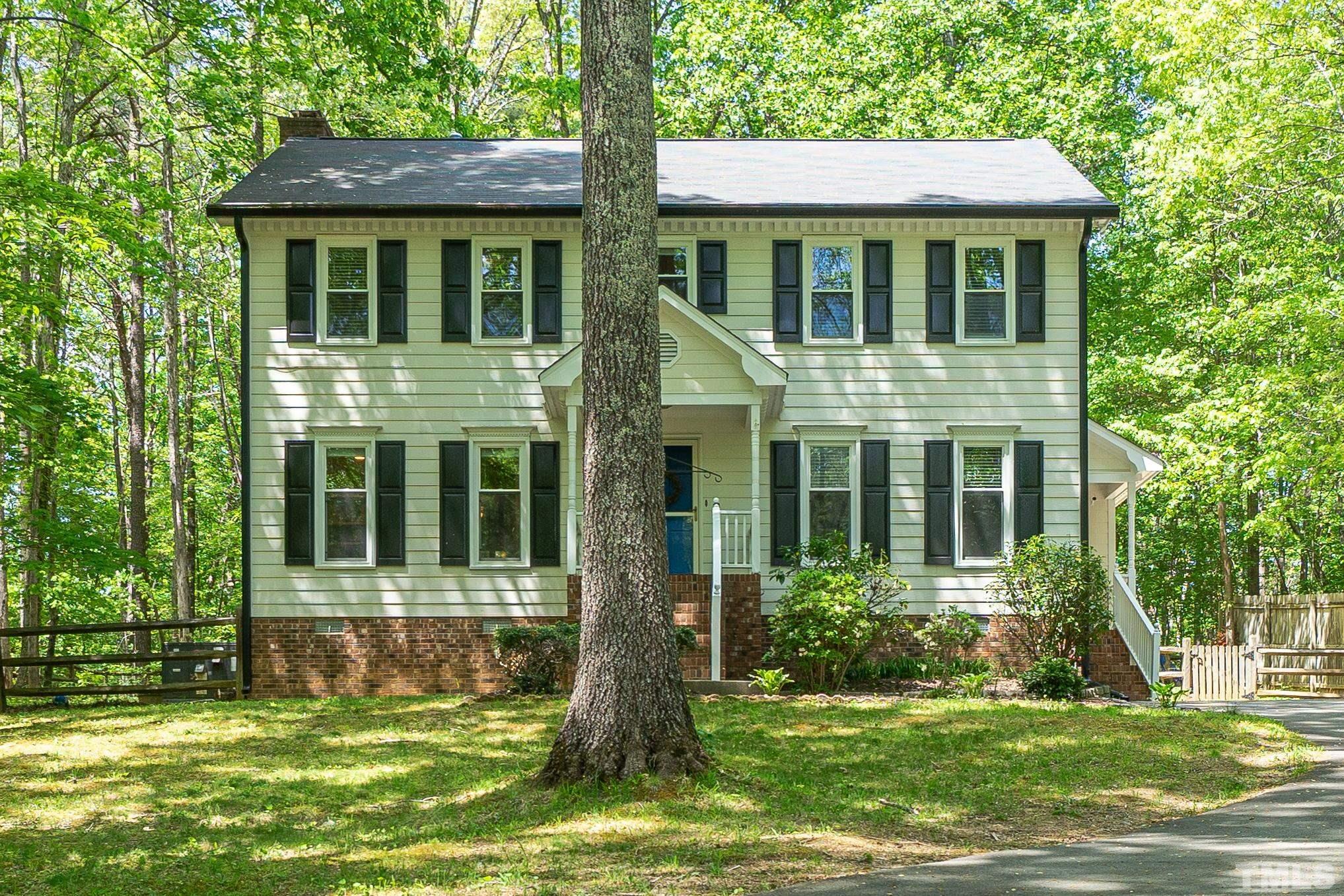 6313 Craig Road Durham, NC 27712 - Photo 3 of 38 a view of a house with a yard