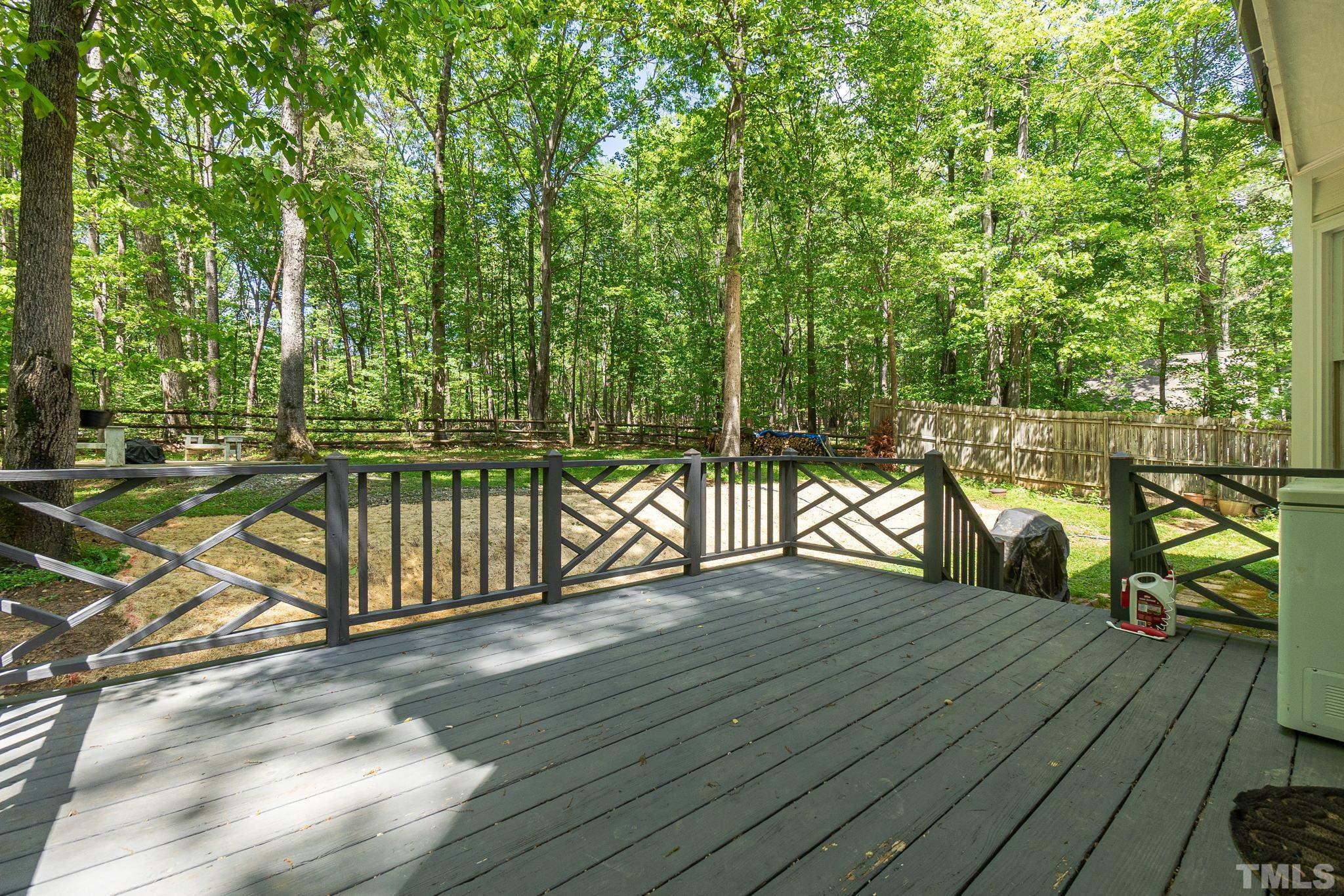 6313 Craig Road Durham, NC 27712 - Photo 35 of 38 a view of a balcony with wooden floor