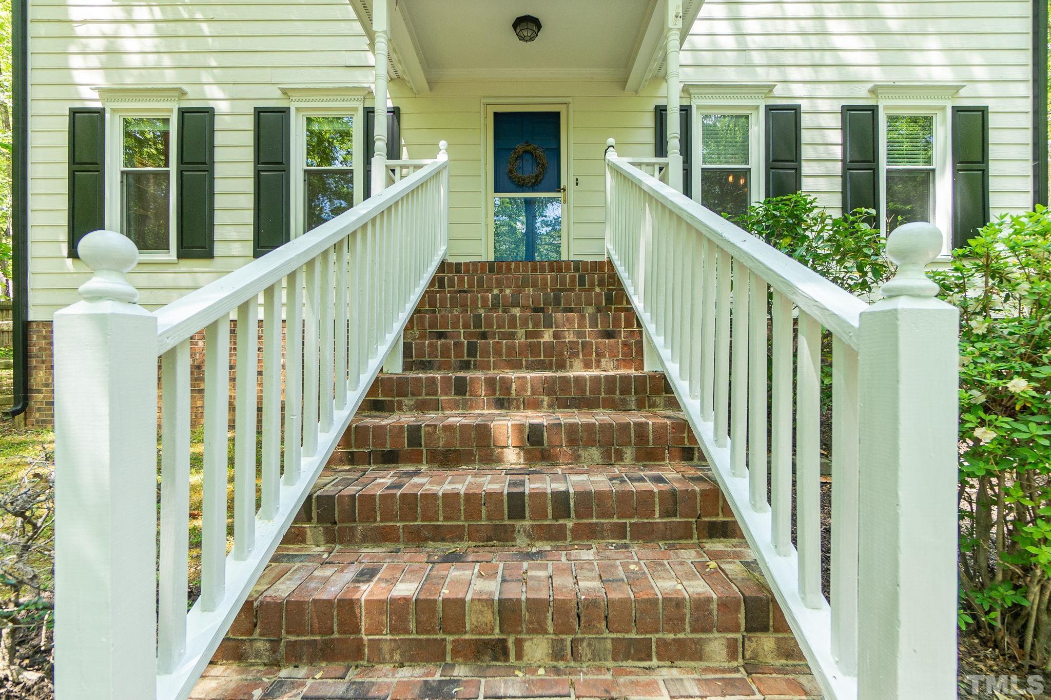 6313 Craig Road Durham, NC 27712 - Photo 4 of 38 a view of a balcony with wooden floor and windows