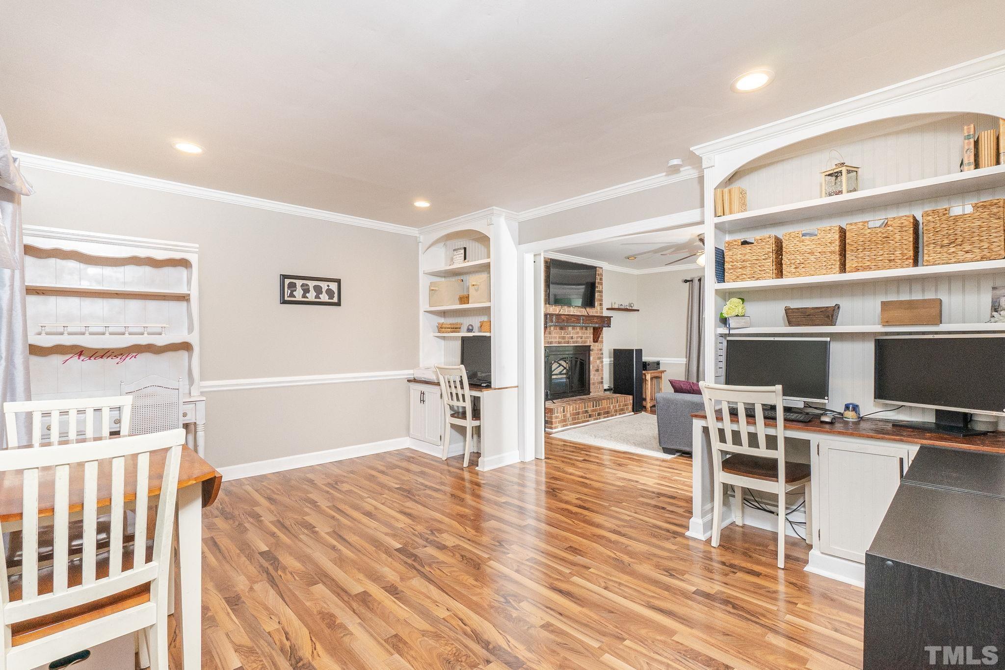 6313 Craig Road Durham, NC 27712 - Photo 6 of 38 a room with furniture and a wooden floor