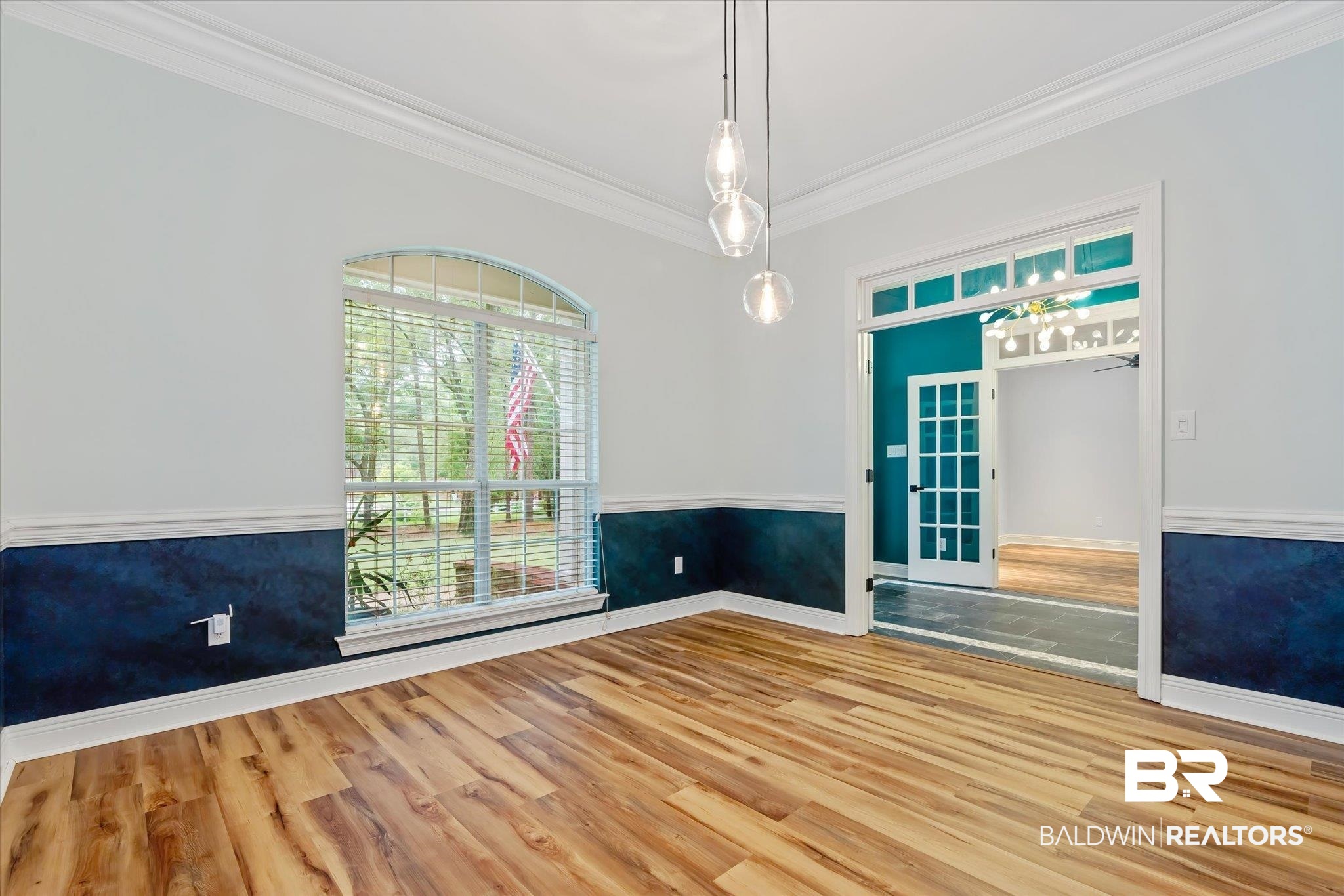 3600 Russells Lane Mobile, AL 36619 - Photo 6 of 43 Unfurnished room featuring ornamental molding and hardwood / wood-style flooring