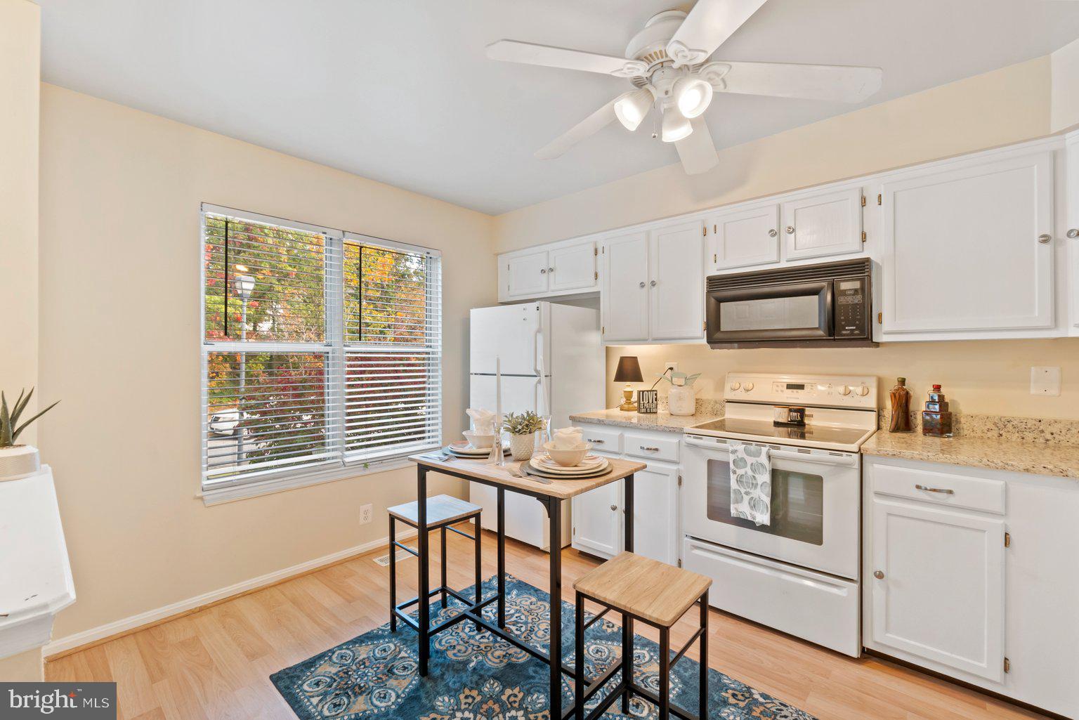 1151 Ingate Road Baltimore, MD 21227 - Photo 8 of 30 Granite countertops add to bright kitchen