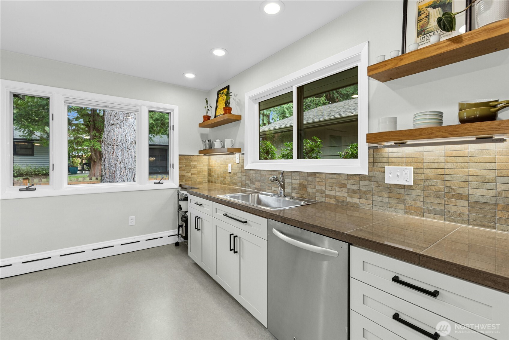 21214 96th Avenue West Edmonds, WA 98020 - Photo 13 of 40 a kitchen with granite countertop a sink and a window