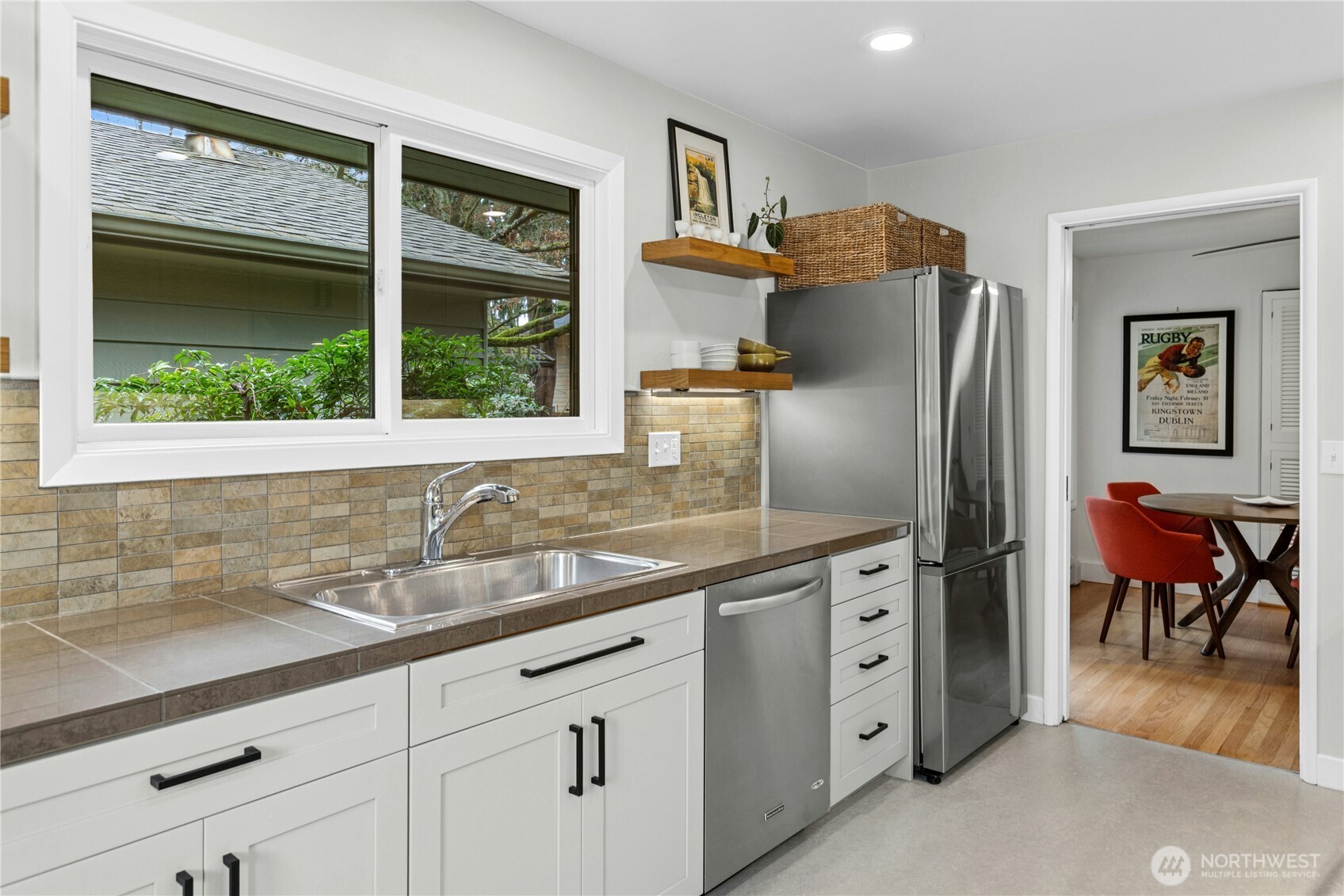 21214 96th Avenue West Edmonds, WA 98020 - Photo 14 of 40 a kitchen with stainless steel appliances granite countertop a refrigerator a sink a stove and a window