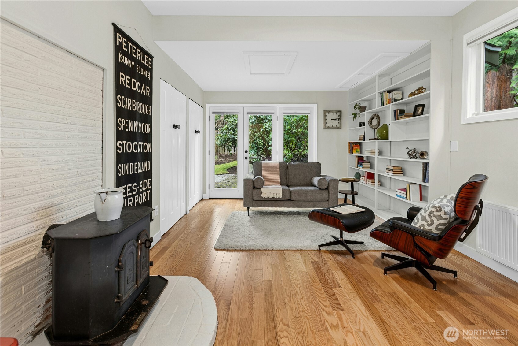 21214 96th Avenue West Edmonds, WA 98020 - Photo 17 of 40 a living room with furniture and a floor to ceiling window
