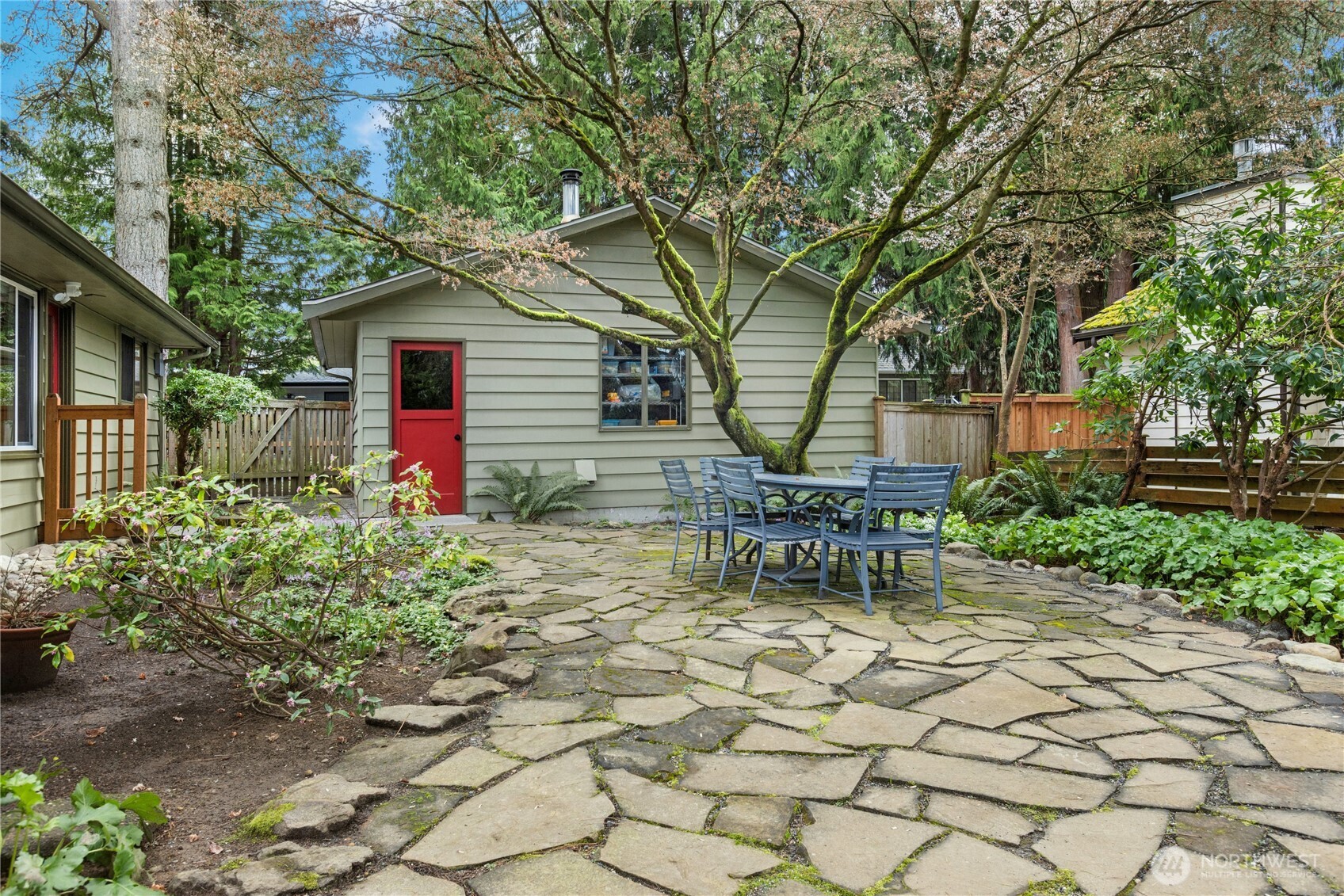 21214 96th Avenue West Edmonds, WA 98020 - Photo 33 of 40 a view of a chair and table in backyard of the house