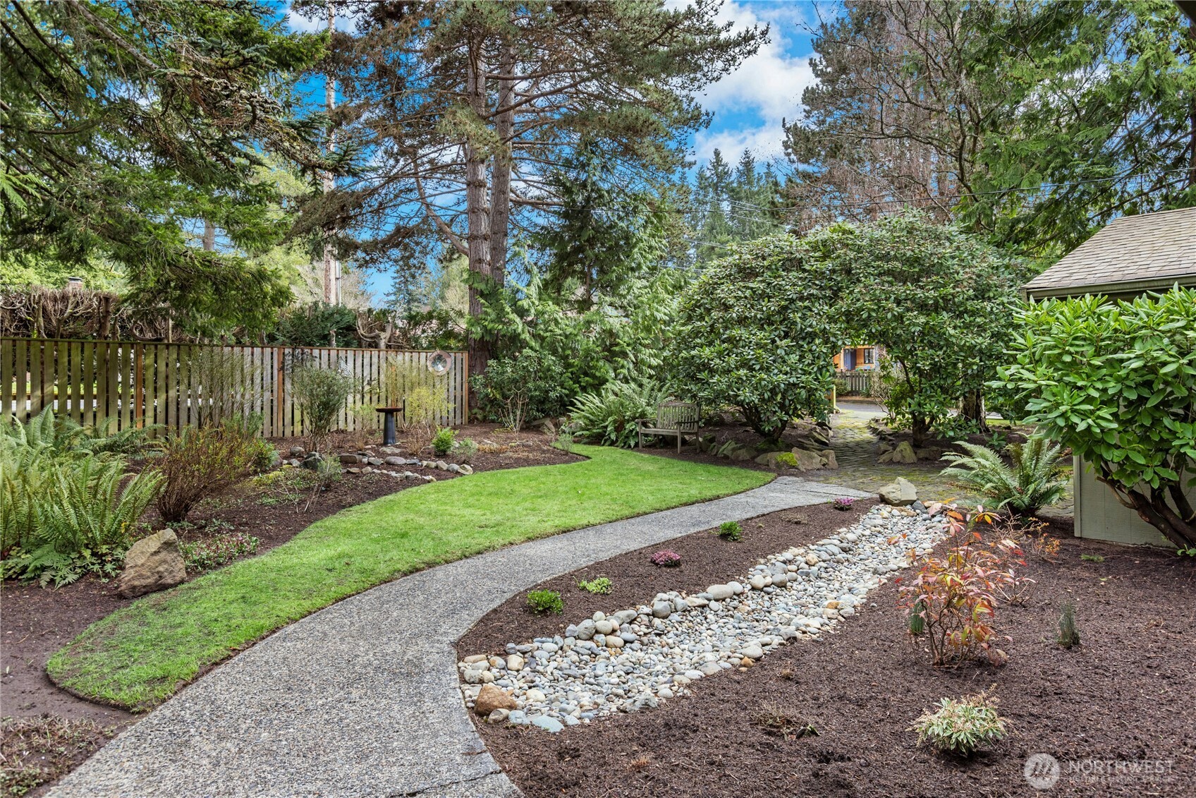 21214 96th Avenue West Edmonds, WA 98020 - Photo 34 of 40 a view of a garden with a fountain