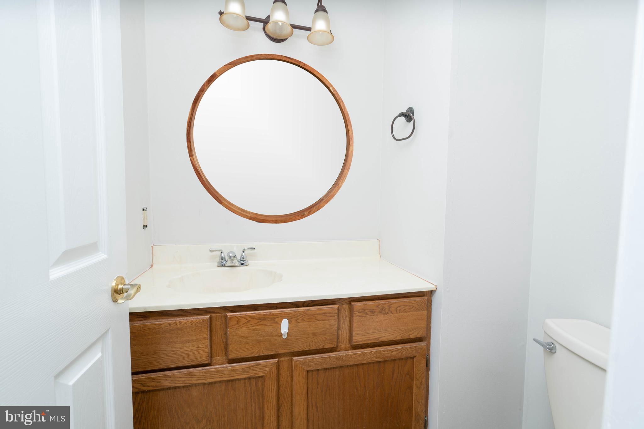 2420 Dogleg Drive Warrington, PA 18976 - Photo 11 of 28 a bathroom with a sink and a mirror