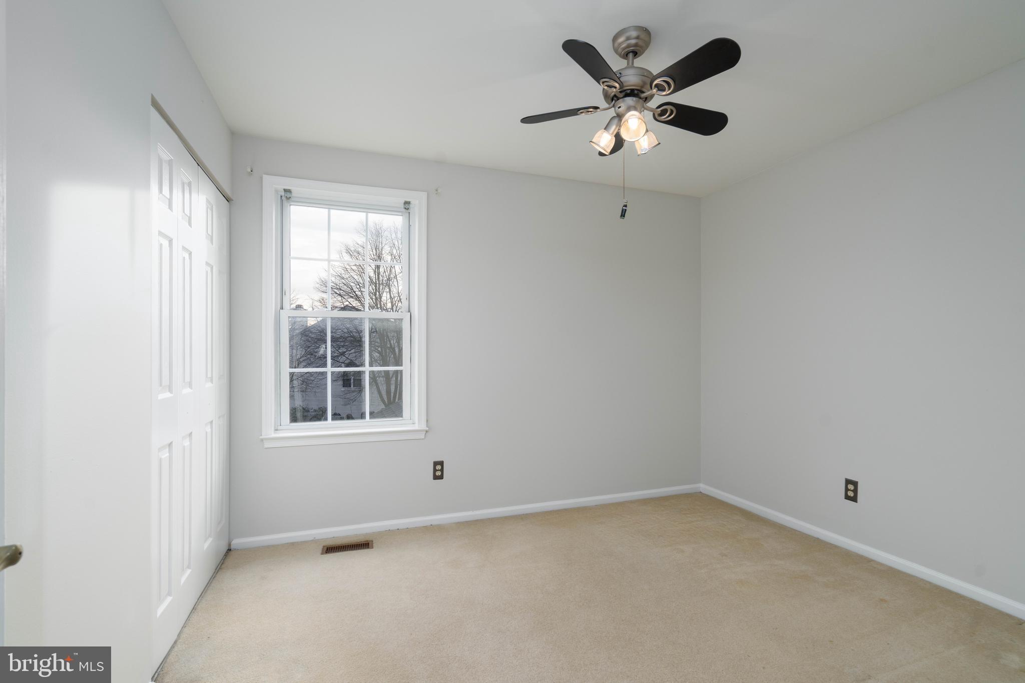 2420 Dogleg Drive Warrington, PA 18976 - Photo 19 of 28 an empty room with a window and a ceiling fan