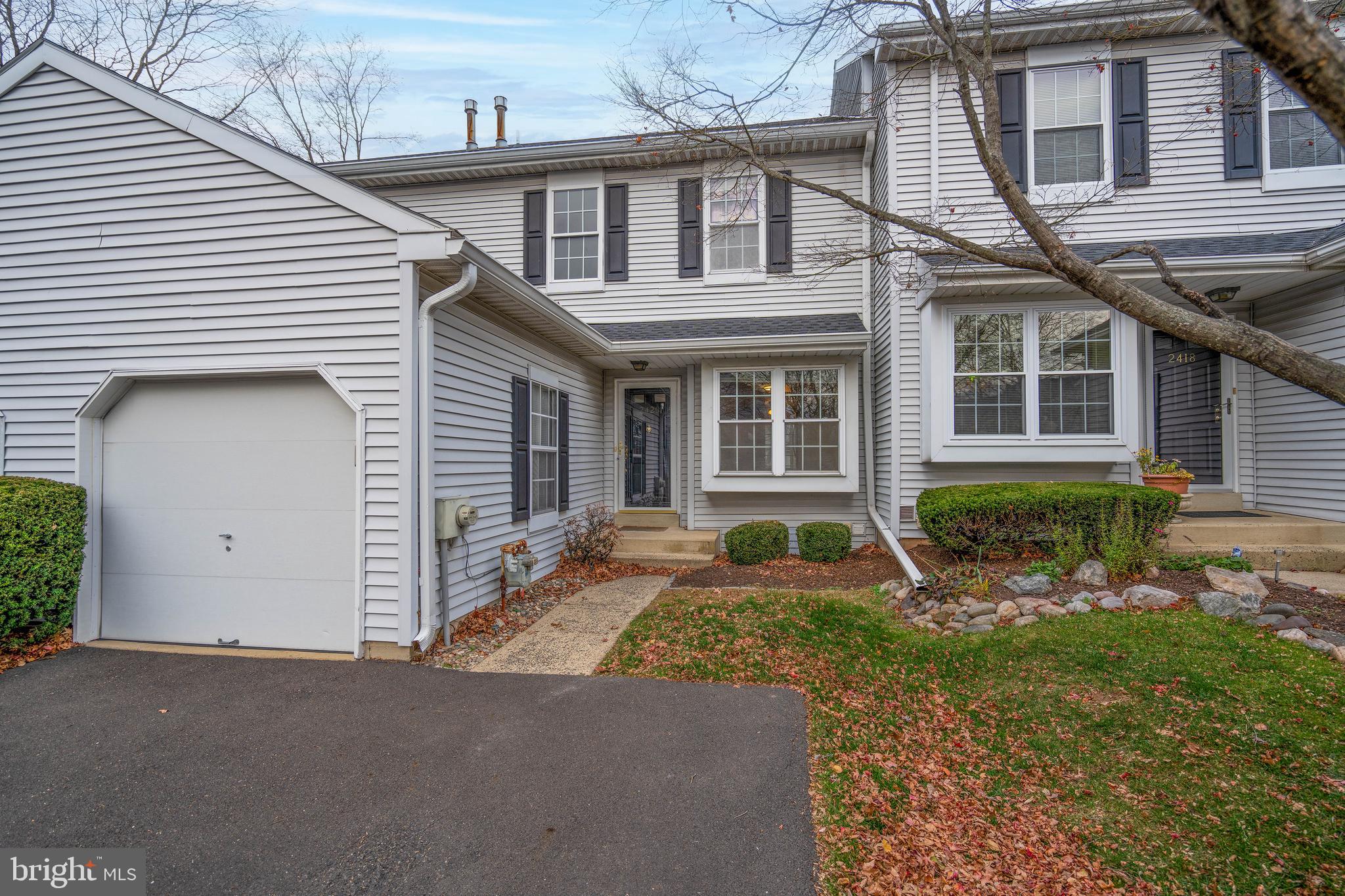 2420 Dogleg Drive Warrington, PA 18976 - Photo 2 of 28 a front view of a house with garden