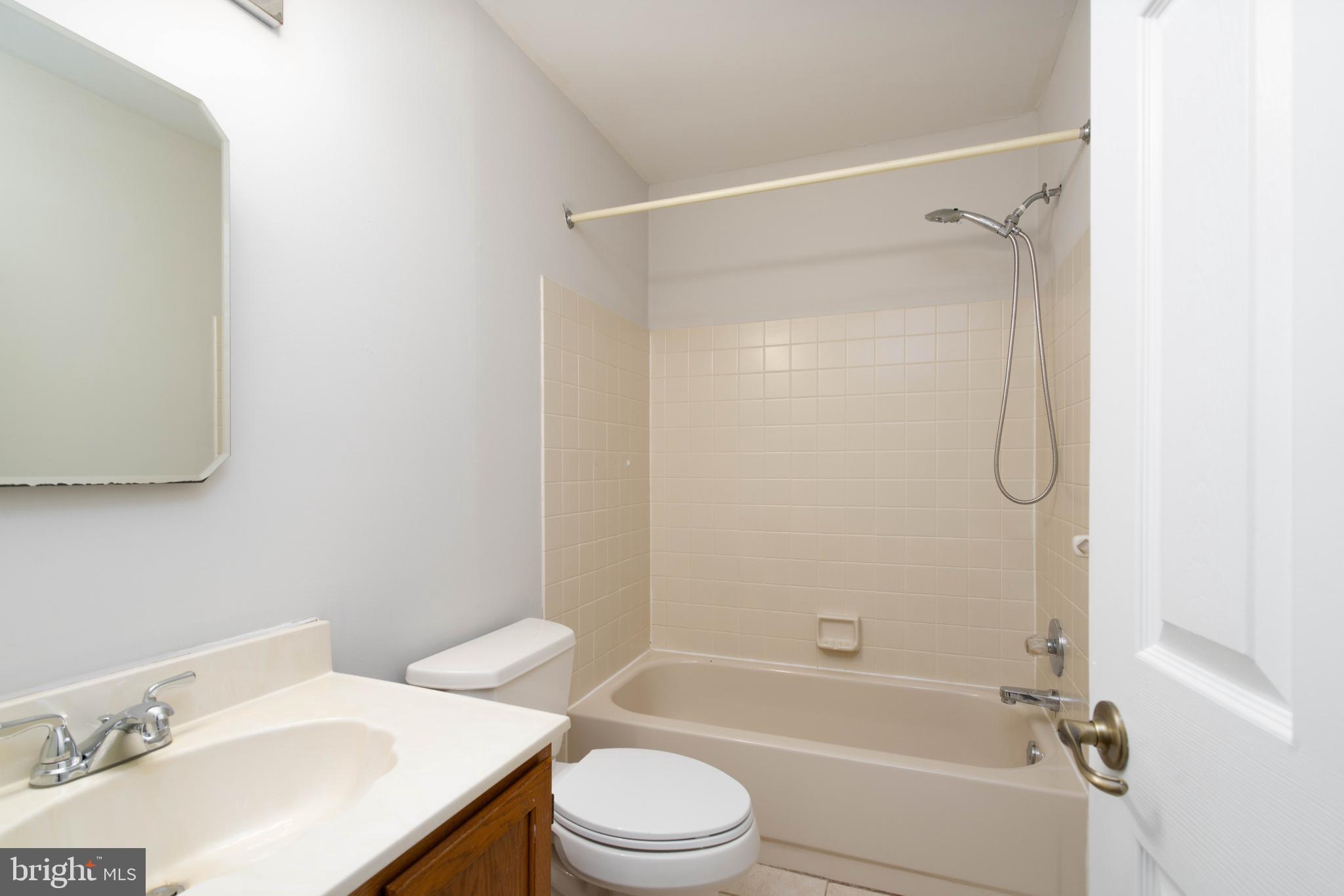 2420 Dogleg Drive Warrington, PA 18976 - Photo 22 of 28 a bathroom with a sink toilet and shower
