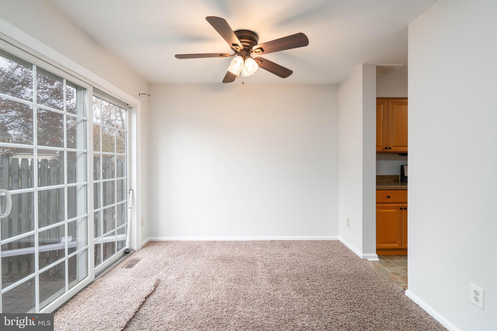 2420 Dogleg Drive Warrington, PA 18976 - Photo 8 of 28 an empty room with windows and a ceiling fan