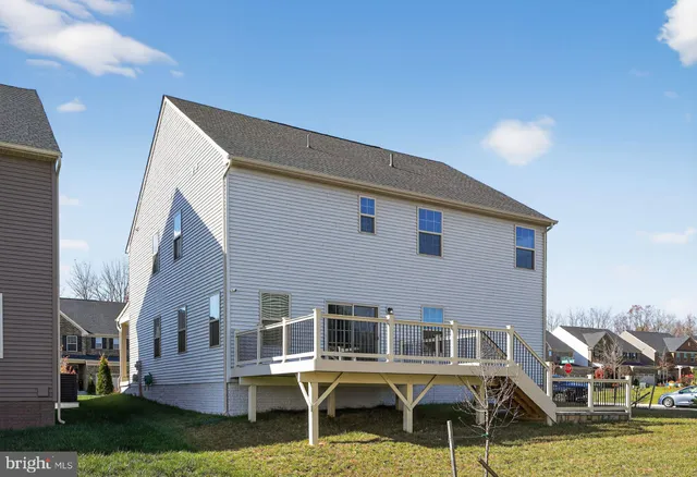 a aerial view of a house with swimming pool and sitting area