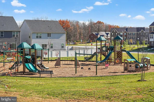 a view of a house with swimming pool and sitting area