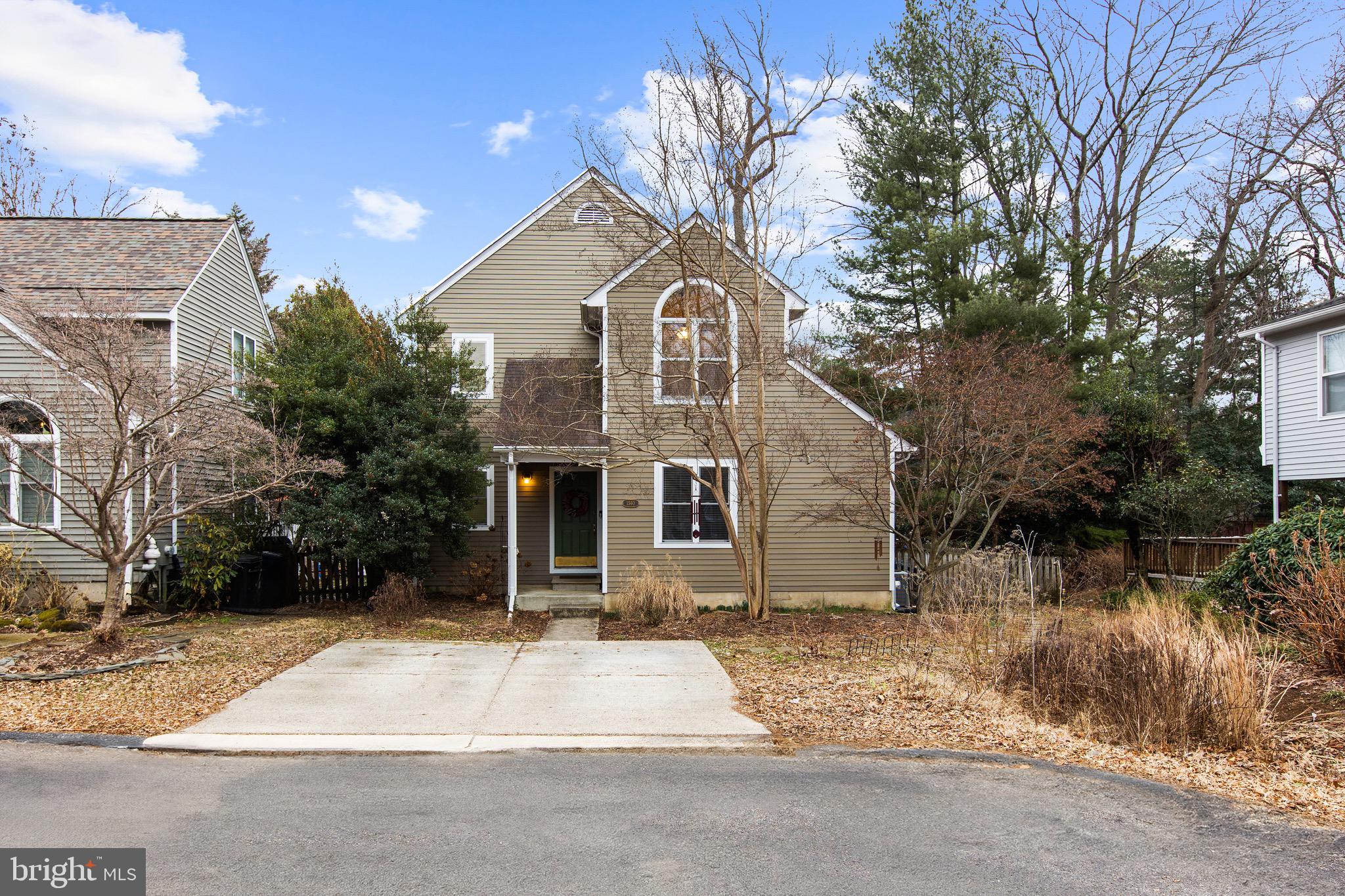 1560 Ritchie Lane Annapolis, MD 21401 - Photo 1 of 54 a front view of a house with a yard and garage